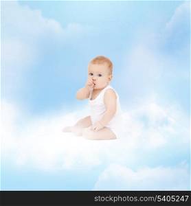 childhood and child care concept - smiling baby sitting on the cloud