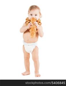 childhood and food concept - cute todler eating long bread