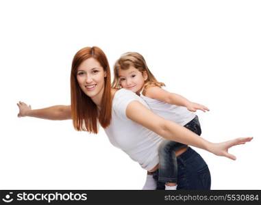 childhood and parenting concept - happy mother and child doing piggy back