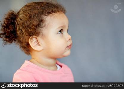 childhood and people concept - beautiful african american little baby girl portrait. beautiful little baby girl portrait