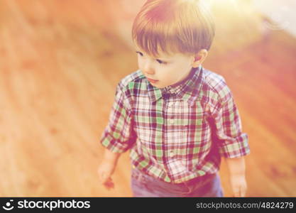 childhood and people concept - happy little baby boy at home. happy little baby boy at home