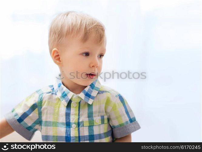 childhood and people concept - happy little baby boy at home. happy little baby boy at home