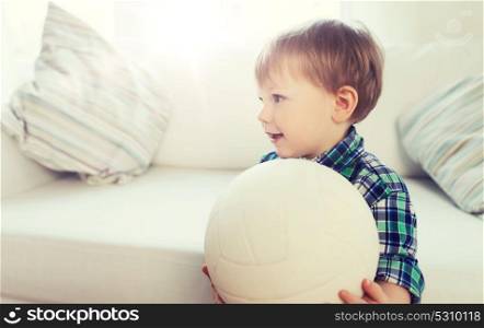 childhood and people concept - happy little baby boy with ball at home. happy little baby boy with ball at home