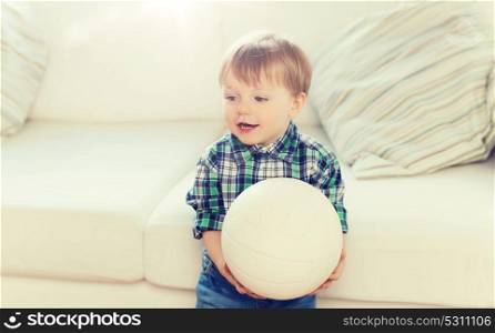 childhood and people concept - happy little baby boy with ball at home. happy little baby boy with ball at home