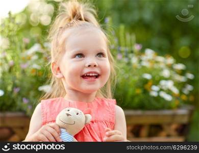 childhood and people concept - portrait of happy beautiful little girl outdoors. portrait of happy beautiful little girl outdoors