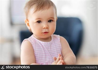 childhood and people concept - portrait of little baby girl at home. portrait of little baby girl at home