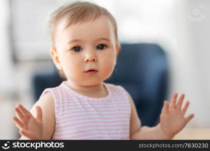 childhood and people concept - portrait of little baby girl at home. portrait of little baby girl at home