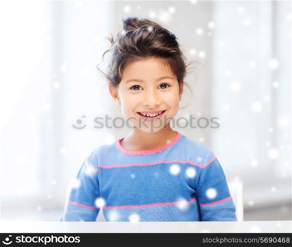 childhood and people concept - smiling little girl indoors