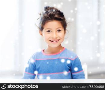 childhood and people concept - smiling little girl indoors