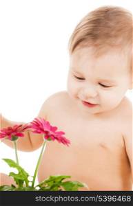 childhood and toys concept - cute little boy playing with flower