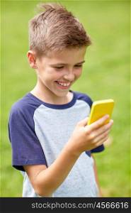 childhood, augmented reality, technology and people concept - happy smiling boy with smartphone playing game in summer park