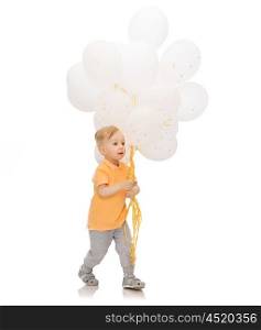 childhood, birthday, holidays and people concept - happy little baby boy with bunch of balloons