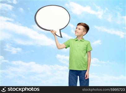 childhood, communication, advertisement and people concept - happy smiling boy in green polo t-shirt holding blank white text bubble banner over blue sky and clouds background