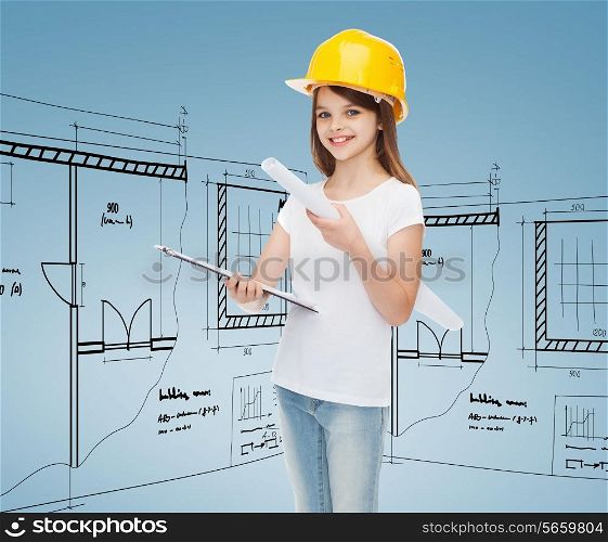 childhood, construction, architecture and people concept - smiling little girl in protective helmet with clipboard and blueprint
