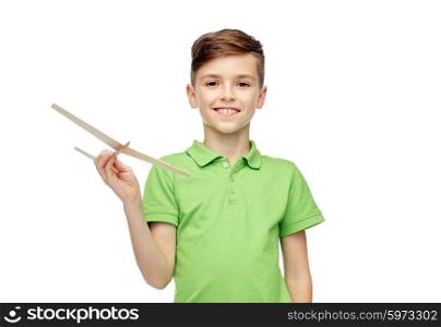 childhood, dream and people concept - happy smiling boy in green polo t-shirt with toy airplane