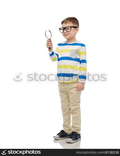 childhood, education, investigation, discovery and people concept - happy little boy in eyeglasses with magnifying glass