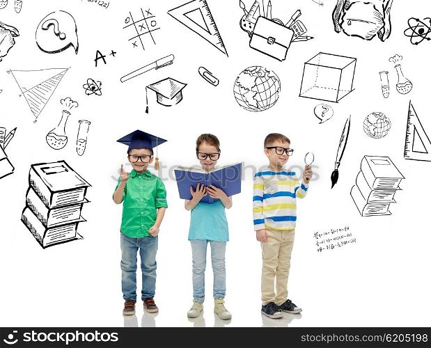 childhood, education, knowledge and people concept - happy little children in eyeglasses with book, magnifying glass and mortar board over school doodles