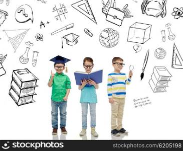 childhood, education, knowledge and people concept - happy little children in eyeglasses with book, magnifying glass and mortar board over school doodles