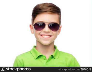 childhood, fashion, accessory, style and people concept - happy smiling boy in sunglasses and green polo t-shirt