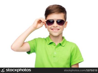 childhood, fashion, accessory, style and people concept - happy smiling boy in sunglasses and green polo t-shirt