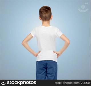 childhood, fashion, advertisement and people concept - boy in white t-shirt and jeans over blue background from back