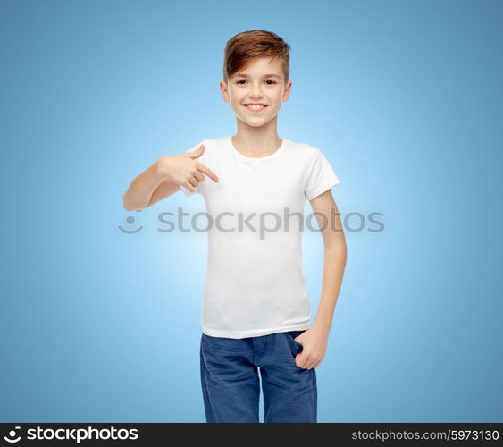 childhood, fashion, advertisement and people concept - happy boy in white t-shirt and jeans pointing finger to himself over blue background