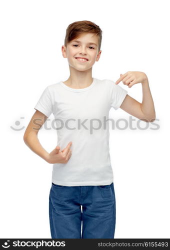 childhood, fashion, advertisement and people concept - happy boy in white t-shirt and jeans pointing finger to himself