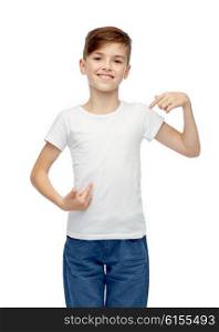 childhood, fashion, advertisement and people concept - happy boy in white t-shirt and jeans pointing finger to himself