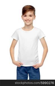 childhood, fashion, advertisement and people concept - happy boy in white t-shirt and jeans