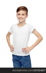 childhood, fashion, advertisement and people concept - happy boy in white t-shirt and jeans