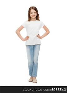 childhood, fashion, advertisement and people concept - smiling little girl in casual clothes
