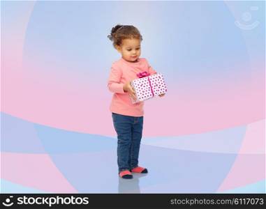childhood, fashion, birthday, holidays and people concept - beautiful little african american baby girl with gift box over pink violet background