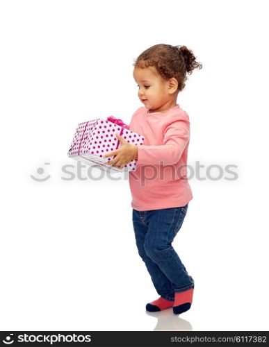 childhood, fashion, birthday, holidays and people concept - beautiful little african american baby girl walking with gift box