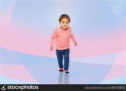 childhood, fashion, clothing and people concept - beautiful little african american baby girl walking over pink violet background