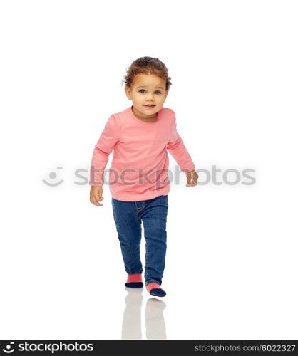 childhood, fashion, clothing and people concept - beautiful little african american baby girl walking