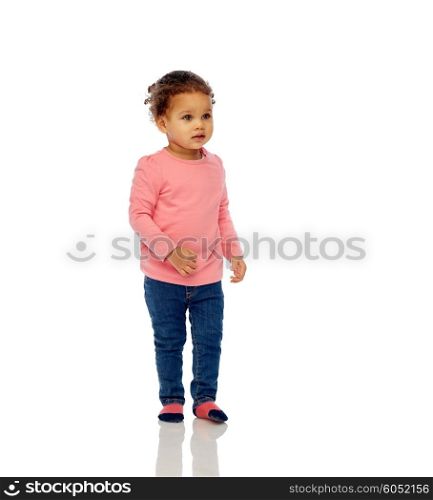 childhood, fashion, clothing and people concept - beautiful little african american baby girl walking