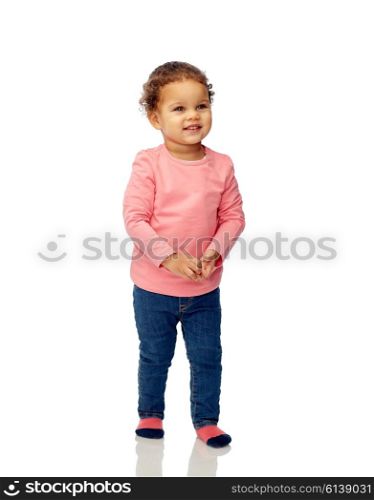 childhood, fashion, clothing and people concept - smiling beautiful african american little baby girl walking