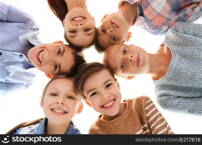 childhood, fashion, friendship and people concept - happy smiling children faces