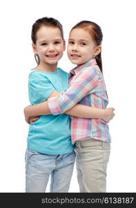 childhood, fashion, friendship and people concept - happy smiling little girls hugging