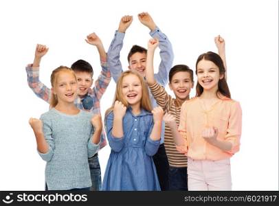 childhood, fashion, gesture and people concept - happy children friends raising fists and celebrating victory