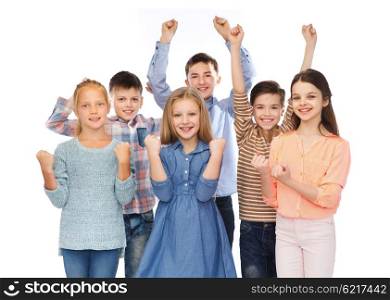 childhood, fashion, gesture and people concept - happy children friends raising fists and celebrating victory