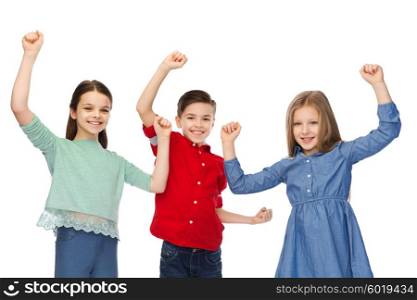 childhood, fashion, gesture and people concept - happy smiling boy and girls raising fists and celebrating victory