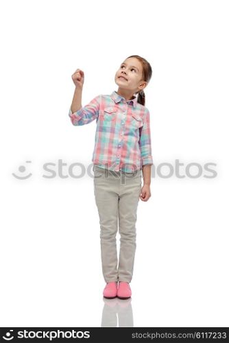 childhood, fashion, imagination and people concept - happy little girl looking up and holding in hand something invisible
