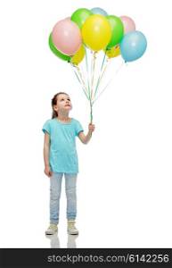 childhood, fashion, imagination and people concept - happy little girl looking up and holding bunch of colorful helium balloons on strand