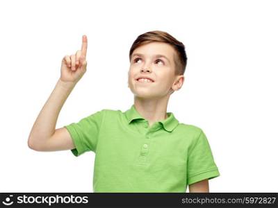 childhood, idea, inspiration and people concept - happy smiling boy in green polo t-shirt pointing finger up