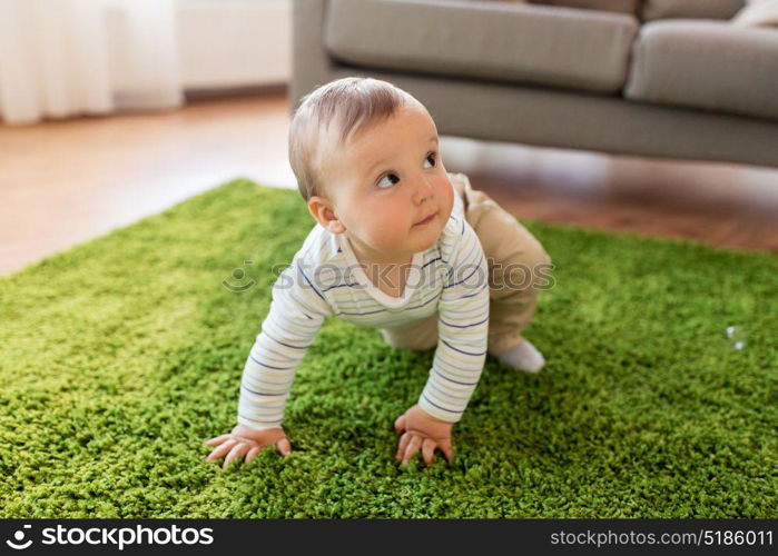 childhood, kids and people concept - lovely baby boy at home. lovely baby boy at home