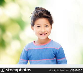 childhood, people and happiness concept - little student girl over green background
