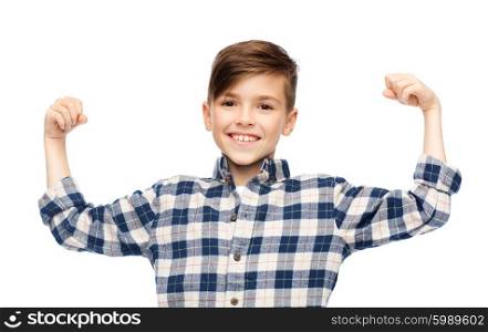childhood, power, strength and people concept - happy smiling boy in checkered shirt showing strong fists