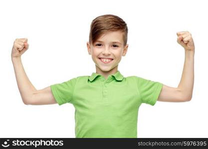 childhood, power, strength and people concept - happy smiling boy in green polo t-shirt showing strong fists