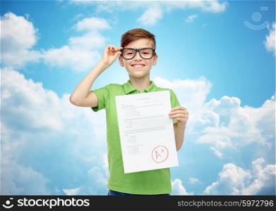 childhood, school, education and people concept - happy smiling boy in eyeglasses holding paper with test result over blue sky and clouds background